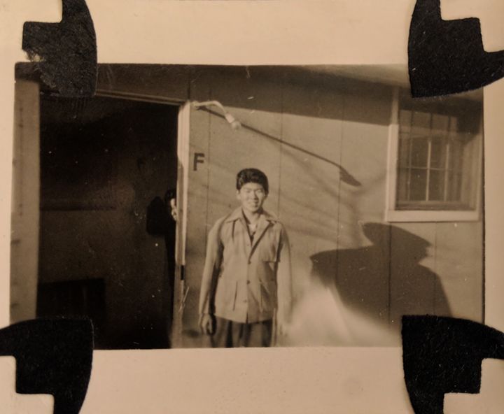 Nakamura-Lin's grandfather, age fifteen, poses inside Granada War Relocation Center (Camp Amache) during World War II