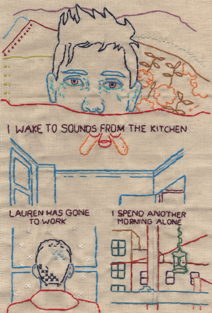 An embroidered comic on tan fabric. The lines are colorful and sparse. In the top frame Andrew is waking up and in the bottom two he is looking out a window. The text reads "I wake to sounds from the kitchen / Lauren has gone to work / I spend another morning alone." 